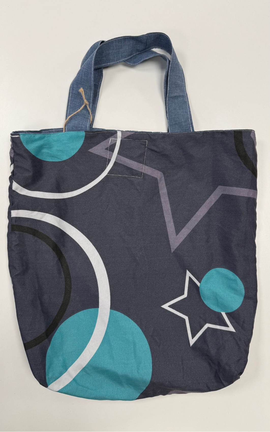 Tote bag with geometric pattern on a white background