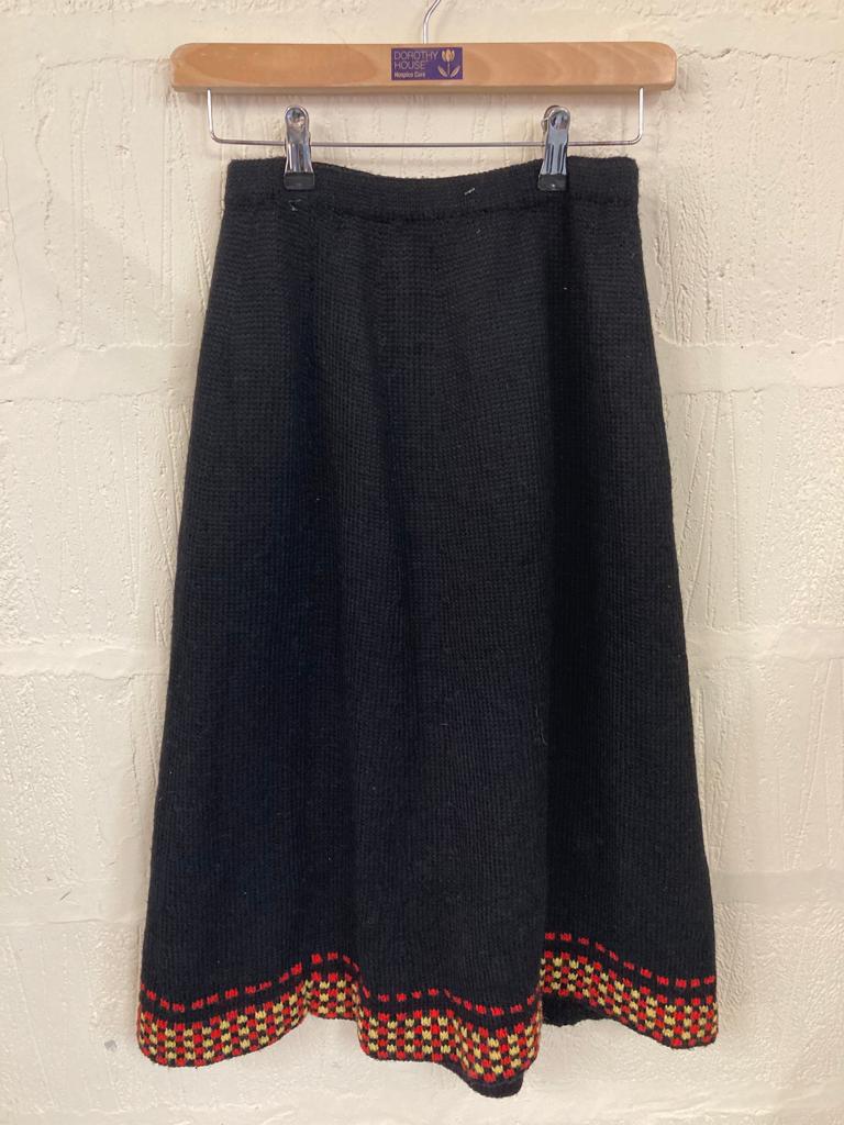 Handmade Black Knitted Skirt with Red and Yellow Pattern at Hem Size 6-8