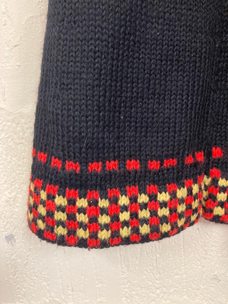 Handmade Black Knitted Skirt with Red and Yellow Pattern at Hem Size 6-8
